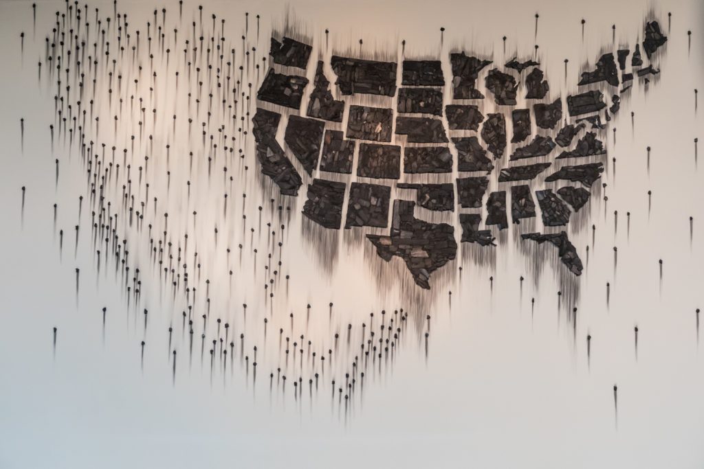 Teresita Fernández, Fire (United States of the Americas) 2, 2018. Charcoal; 137 x 442 x 1 in. (overall). Installation view, Fire (United States of the Americas) 2, McNay Art Museum, San Antonio, TX, 2018. Courtesy the artist; Lehmann Maupin, New York, Hong Kong and Seoul; and McNay Art Museum.