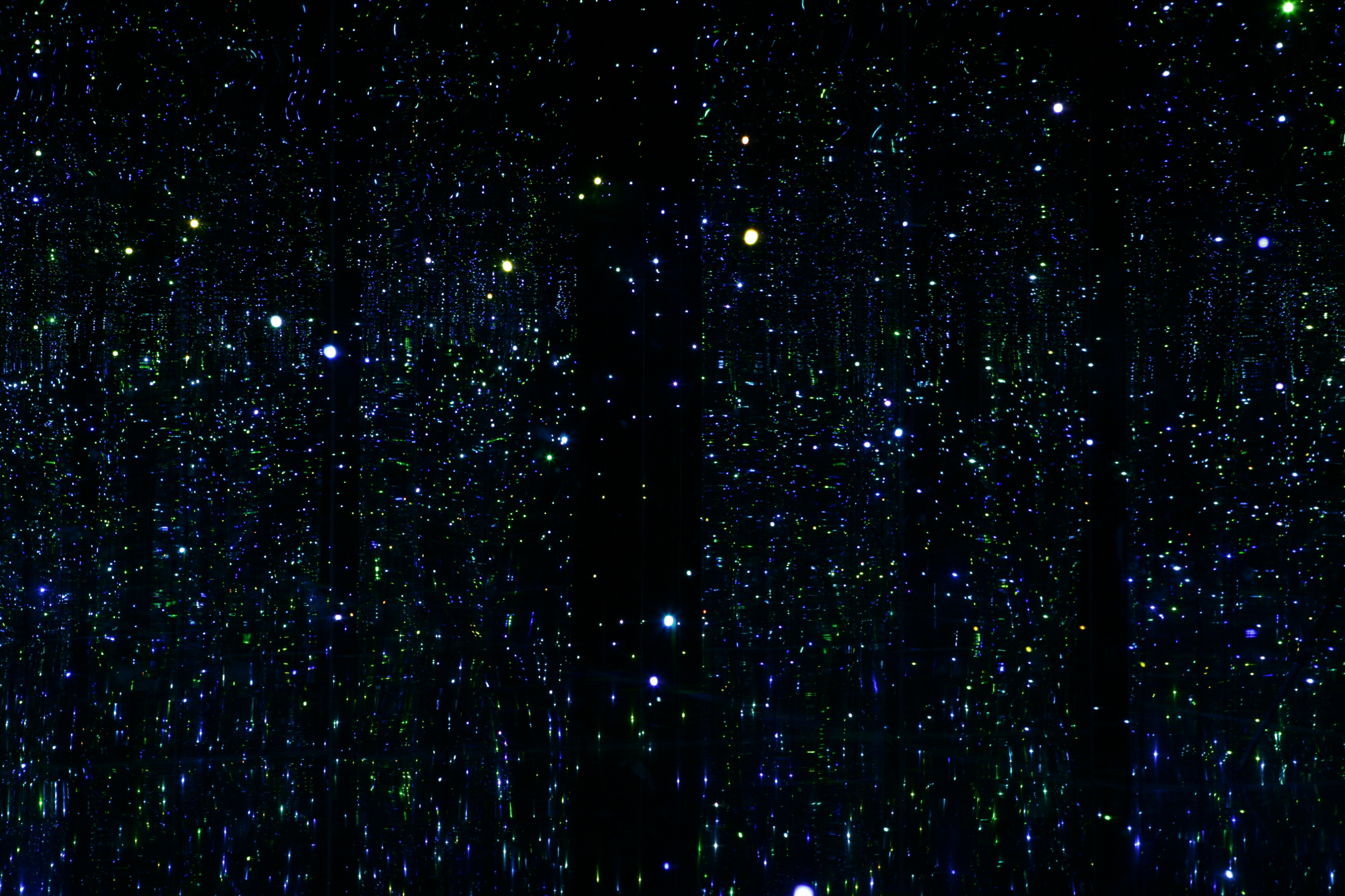 Yayoi Kusama, You Who are Getting Obliterated in the Dancing Swarm of Fireflies (Tú que estás siendo obliterado por una multitud de luciérnagas danzantes), 2005, mixed media installation with LED lights, Museum purchase with funds provided by Jan and Howard Hendler.