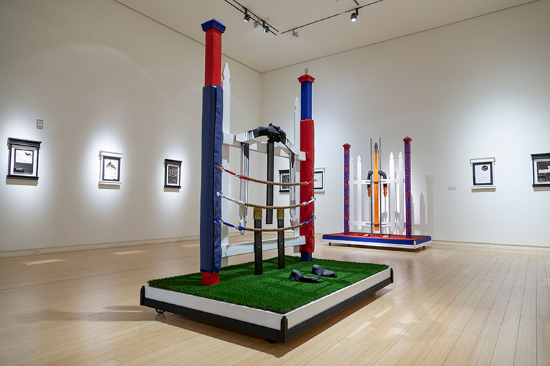 Aaron Coleman, Ropr-Or-Dope, 2019. Lumber, hardware, rope, cast plaster, tassels, turf, latex, enamel and acrylic. Installation view, True and Livin’, 2020, Mesa Contemporary Arts Museum. Courtesy of the artist. Photo: Tamrin Ingram.