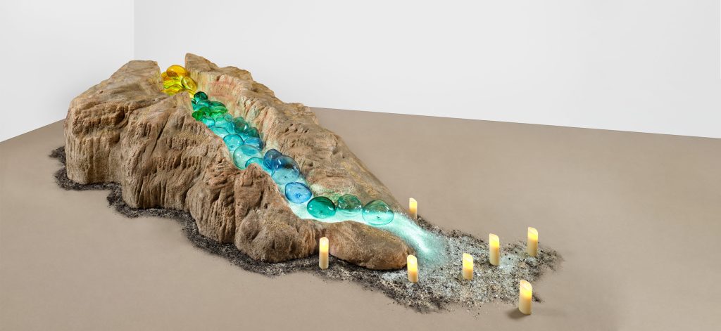 Amalia Mesa-Bains, What the River Gave to Me, 2002. Mixed media installation including hand-carved and painted sculptural landscape, LED lighting, crushed glass, hand-blown and engraved glass rocks, candles; 48 x 48 x 168 in. Courtesy of the artist and Rena Bransten Gallery, San Francisco. Photo: John Janca.