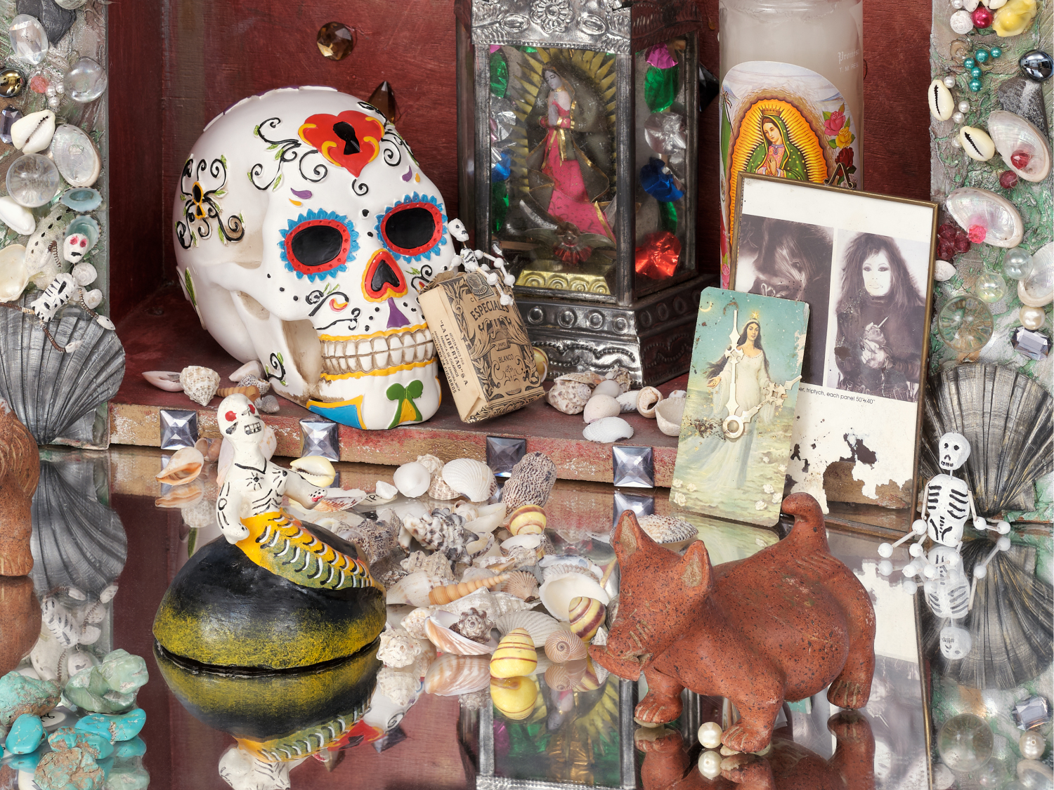 Amalia Mesa-Bains, Queen of the Waters, Mother of the Land of the Dead: Homenaje a Tonatzin/Guadalupe, 1992. Mixed media installation including fabric drape, six jeweled clocks, mirror pedestals with grottos, nicho box, found objects, dried flowers, dried pomegranate, potpourri; 120 x 216 x 72 in. Courtesy of the artist and Rena Bransten Gallery, San Francisco.